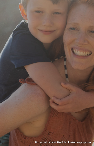 Image: Woman with son on back